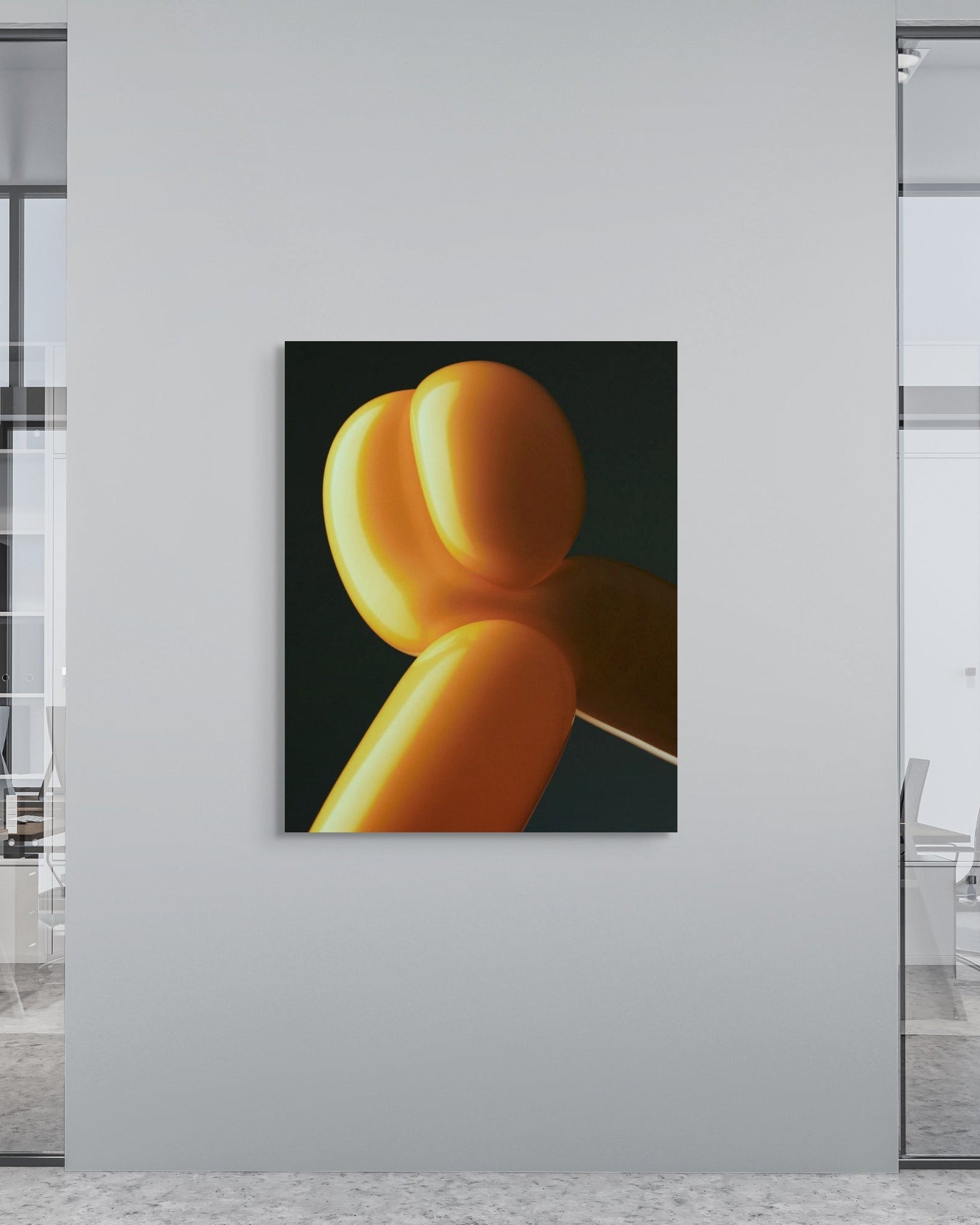 Modern office interior with a metal print of yellow balloons on a white wall.