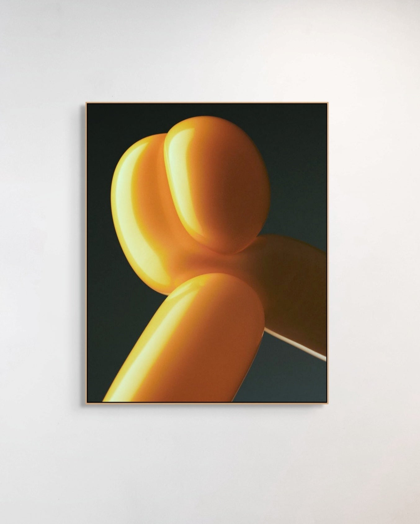 Abstract art piece with yellow and orange shapes on a dark background