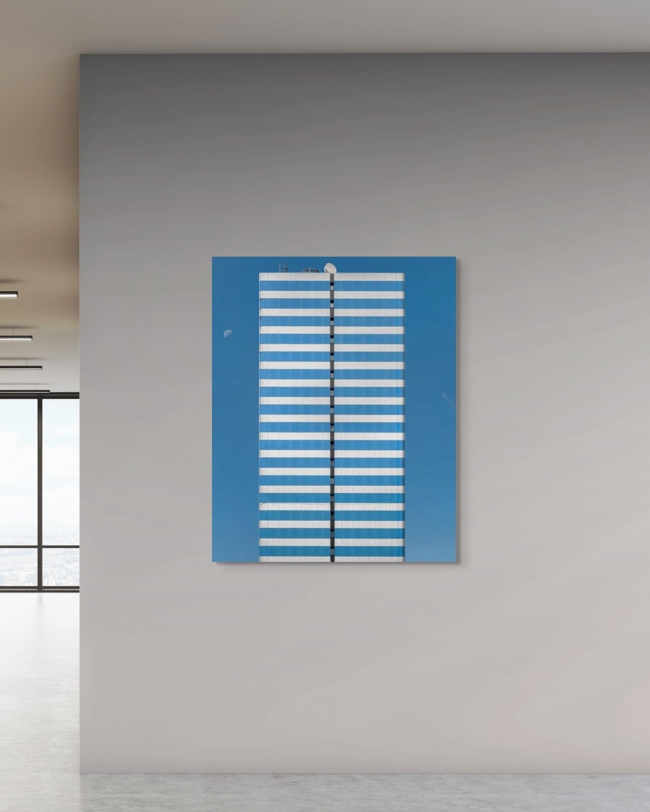 Abstract artwork with blue and white stripes on a gray wall